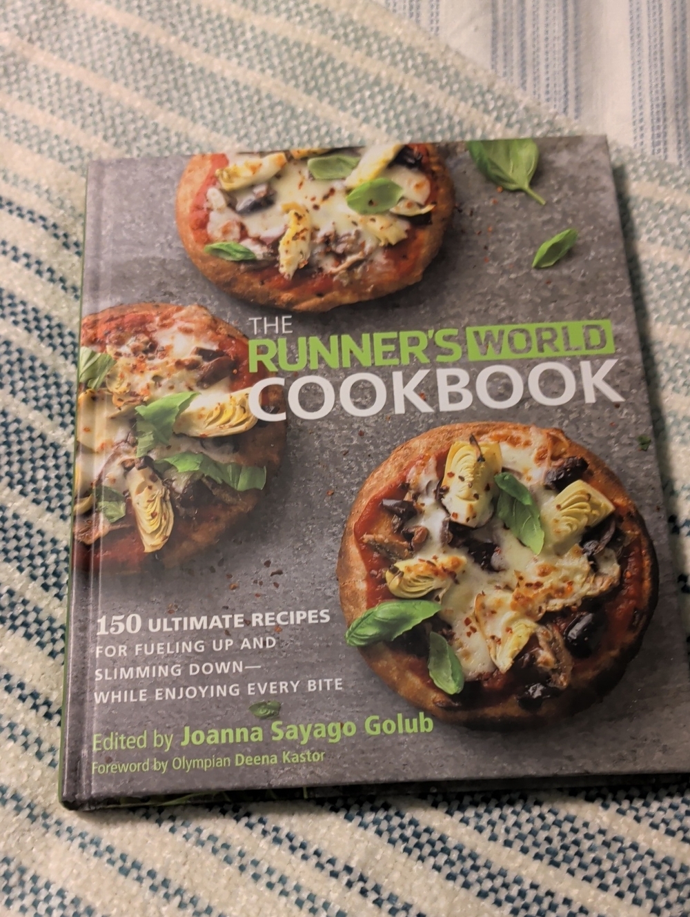 The Runner's World Cookbook by Joanna Sayago Golub - Green Cover